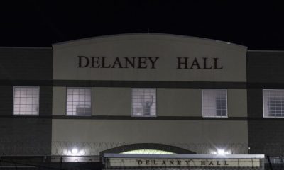 Delaney Hall building at night with lit windows