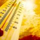 Thermometer showing high temperature against bright sky