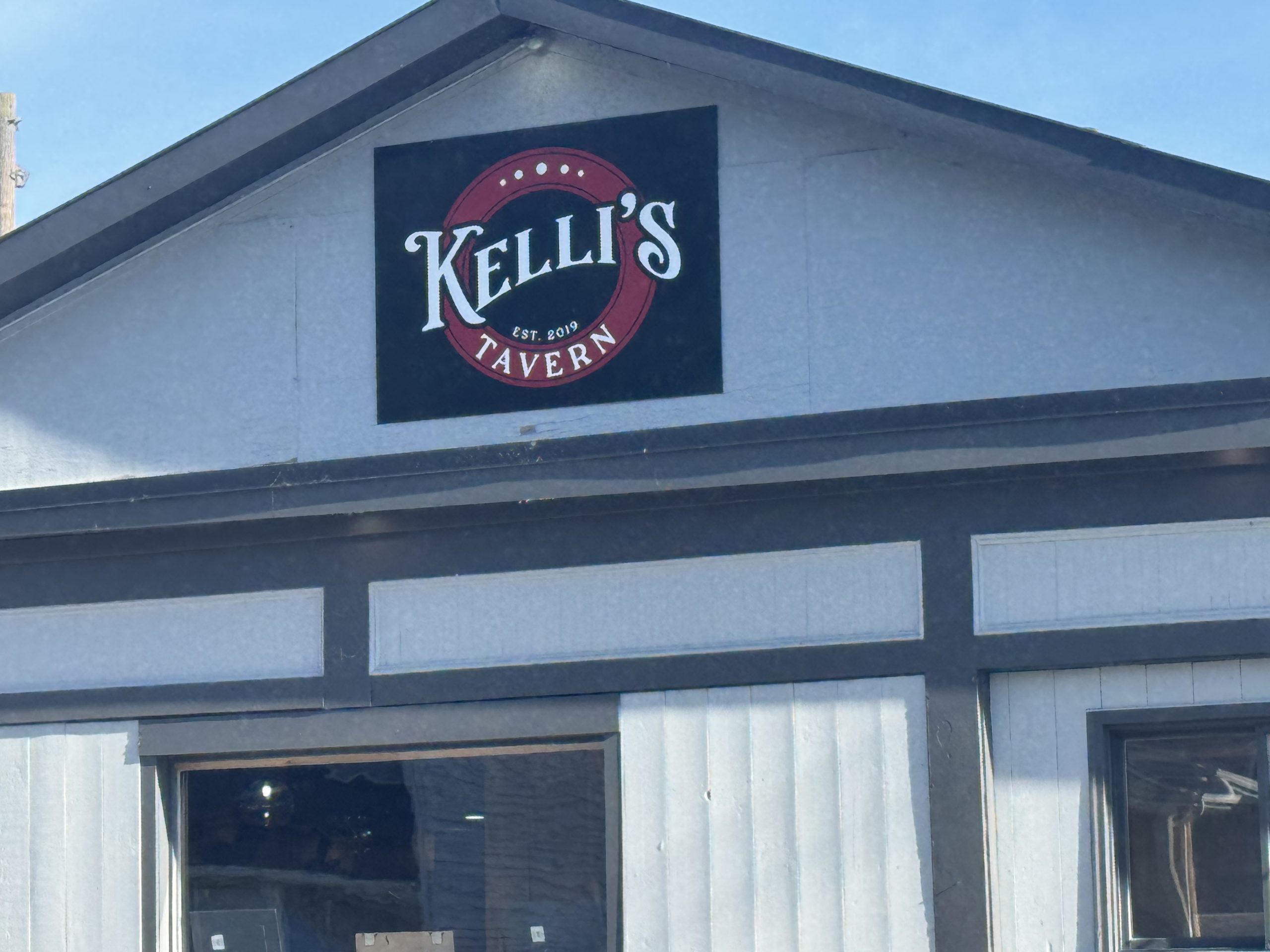 Kelli's Tavern sign on building facade