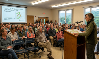 Community meeting with speaker addressing seated audience