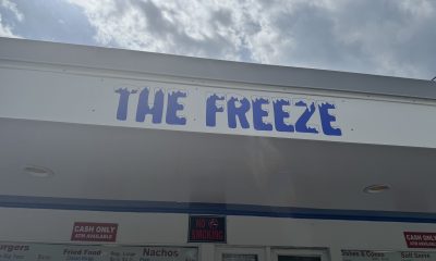 The Freeze ice cream stand sign under cloudy sky