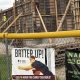 Construction site behind fence with baseball banners