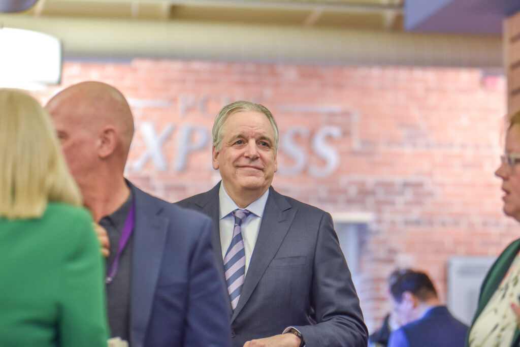 Man in suit at indoor networking event