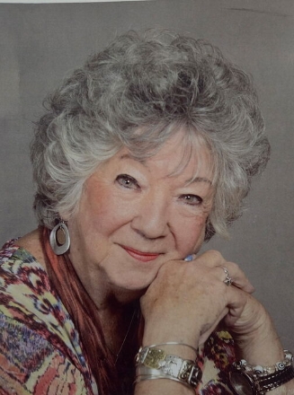 Smiling elderly woman with curly gray hair portrait