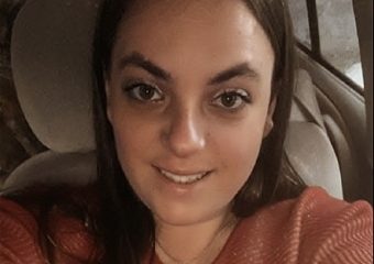 Woman taking selfie inside a parked car