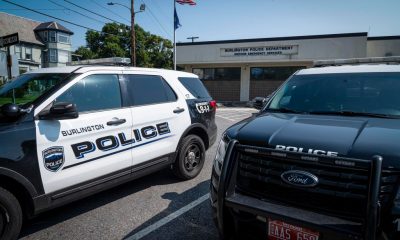 Burlington police SUVs parked outside police department