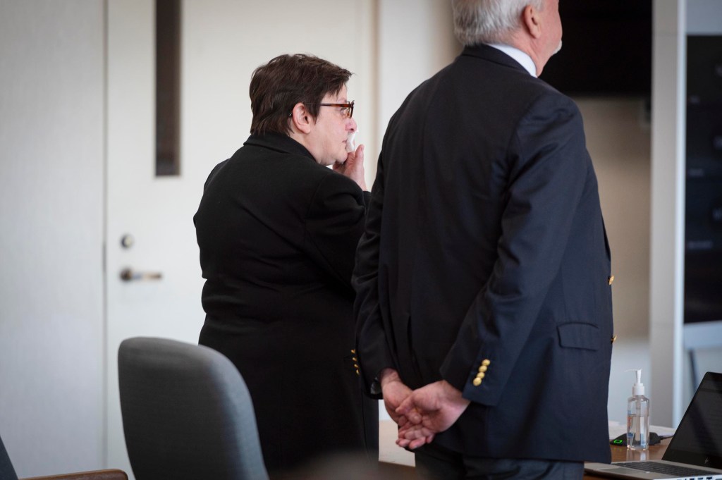 Two officials standing in a conference room