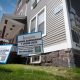 Now leasing signs outside residential house