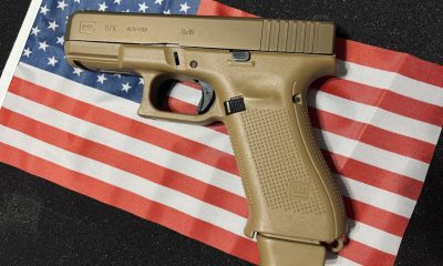 Tan Glock pistol on American flag