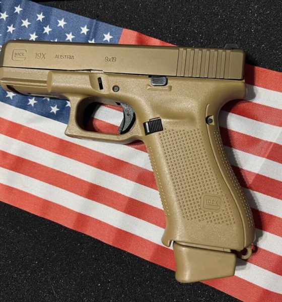 Tan Glock pistol on American flag