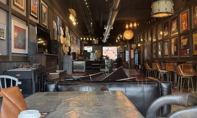 Industrial-style coffee shop interior with artwork and seating