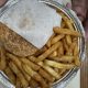 Burger and French fries in foil tray