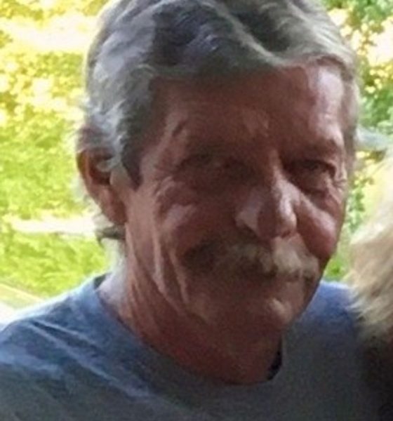 Older man with gray hair outdoors