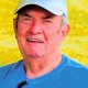 Elderly man in blue cap smiling outdoors