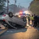 Overturned car with police at crash scene