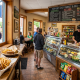 Interior of Vermont Chef deli with sandwiches and customers