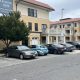 Apartment complex with parked cars and leasing sign