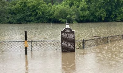 Flooded Milwaukee County Cemetery sign and fence