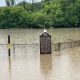 Flooded Milwaukee County Cemetery sign and fence