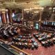 Ornate legislative chamber during government session