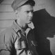 Black-and-white portrait of young soldier in uniform