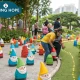Colorful garden gnomes displayed in urban park