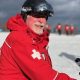 Ski patrol member in red jacket on snow