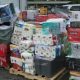 Shrink-wrapped pallets of assorted household goods and tools