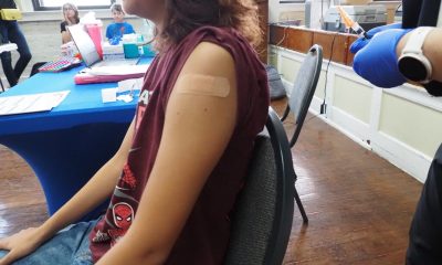 Child receiving vaccination in clinic setting