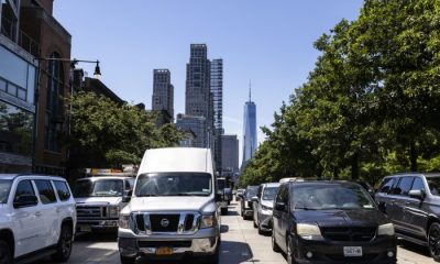 Busy street in New York City with traffic and skyscrapers in the background, incl — new york climate superfund law blocked