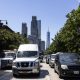 Busy street in New York City with traffic and skyscrapers in the background, incl — new york climate superfund law blocked