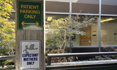 Signage for patient parking and expectant mothers at a medical facility, surrounded by — High Risk Pregnancy Abortion Bans