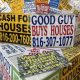 Colorful signs advertising cash offers for homes, featuring phone numbers and phrase — real estate wholesaling regulations