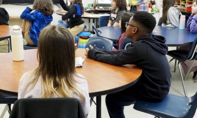 Students attentively listen in a classroom setting, with a focus on thei — Federal Education Spending Monitoring Suspended