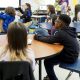 Students attentively listen in a classroom setting, with a focus on thei — Federal Education Spending Monitoring Suspended