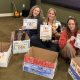 Three women sitting on the floor with decorated boxes, promoting a screen-free ch — screen-free childhood Croton-on-Hudson