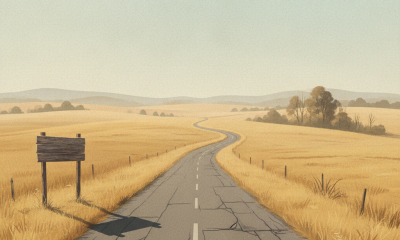 A winding road through a dry, golden landscape under a clear sky, symbolizing heat advis — Bennington County heat advisory