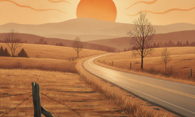 A sun setting over a rural landscape with a thermometer showing 102°F, symbolizing a he — Bennington County heat advisory
