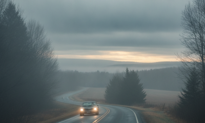 A car drives on a winding road through foggy conditions in Bennington County, with ov — Bennington County weather forecast