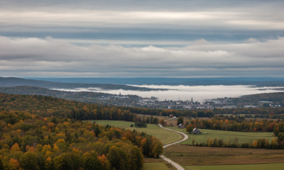 Overcast skies above a rural landscape in Bennington County, with houses and trees displa — Bennington VT weather forecast