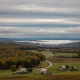 Overcast skies above a rural landscape in Bennington County, with houses and trees displa — Bennington VT weather forecast