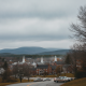 Overcast skies loom over a small town in Bennington, Vermont, with church steeples visibl — Bennington VT weather forecast