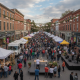 Crowd gathered at Garlic Town USA festival in downtown Bennington, with food stalls and live music.