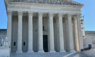 The U.S. Supreme Court building with its iconic columns and steps, under a clear blue sky. — Supreme Court mail voting rule