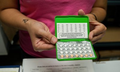 Person holding open birth control pill pack — florida reproductive healthcare access