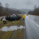 A rolled-over SUV on the shoulder of Route 7 in Shaftsbury, VT, with emergency responders an — Route 7 crash Shaftsbury VT
