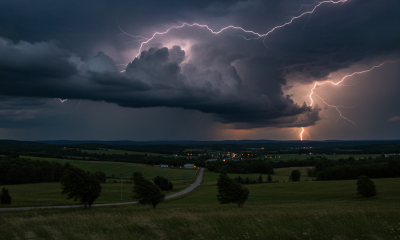 Dramatic storm clouds with lightning over a rural landscape, indicating a se — severe thunderstorm watch Bennington County