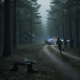 A fugitive running through a forest with police lights in the background; aband — shaftsbury vermont state police fugitive