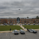 Police vehicles respond outside a building amid Southern Vermont school swatting threats.