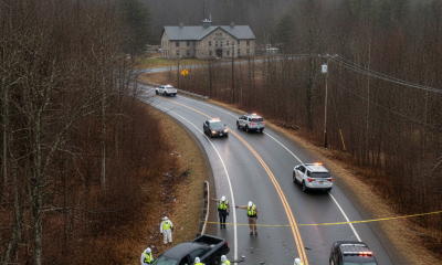 Emergency responders investigate a fatal crash scene on a winding road in Ve — Vermont State Police Shaftsbury fatal crash
